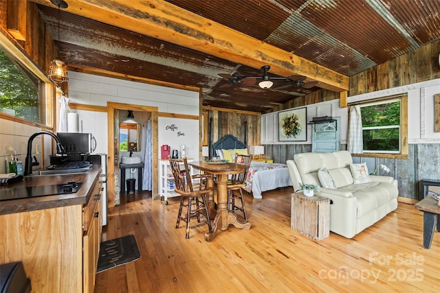 553 Paradise Mountain Rd, Canton, NC 28716 - dining room with hardwood / wood-style flooring, ceiling fan, wood walls, and beamed ceiling