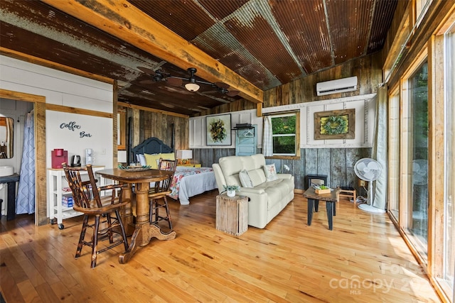 553 Paradise Mountain Rd, Canton, NC 28716 - dining space with an AC wall unit, hardwood / wood-style floors, and wood walls