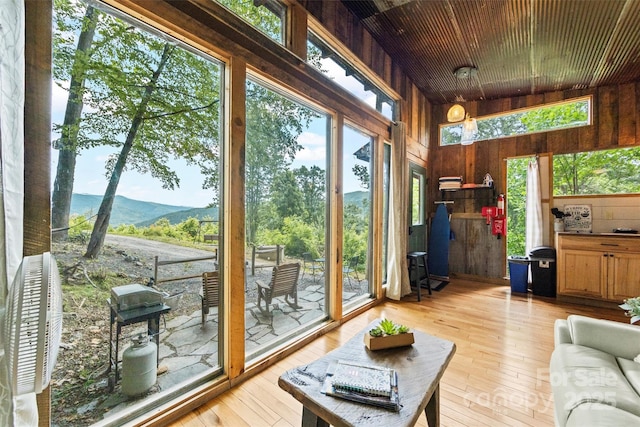 553 Paradise Mountain Rd, Canton, NC 28716 - sunroom / solarium with wooden walls, a mountain view, and hardwood / wood-style flooring
