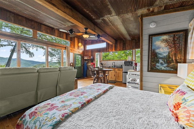 553 Paradise Mountain Rd, Canton, NC 28716 - bedroom with wood walls, multiple windows, wooden ceiling, wood finished floors, and refrigerator