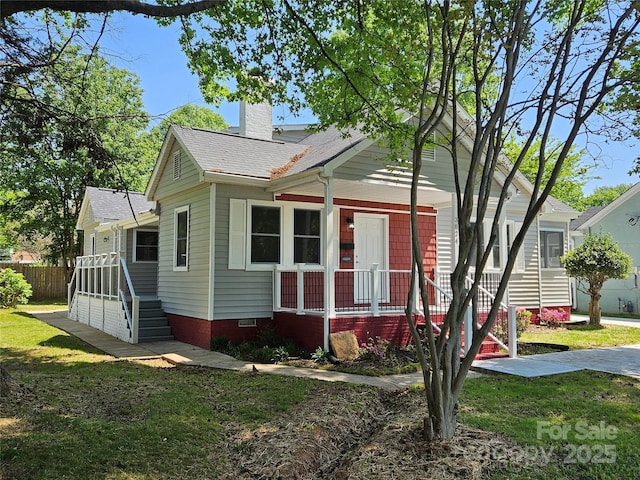 3824 Freedom Dr, Charlotte, NC 28208 - view of front of property with crawl space, a chimney, and roof with shingles