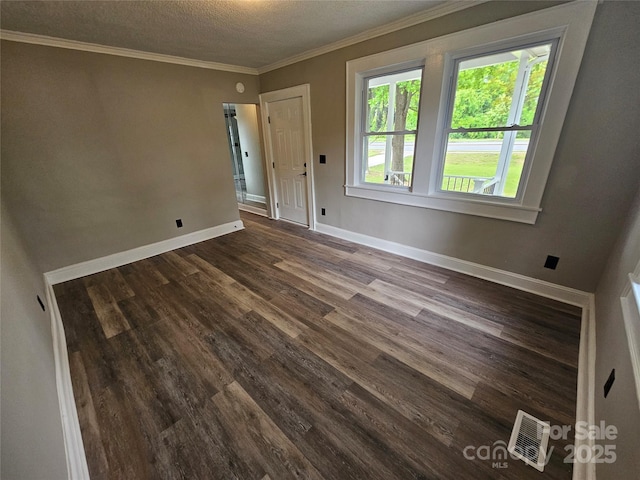 3824 Freedom Dr, Charlotte, NC 28208 - unfurnished room with dark wood-style floors, a textured ceiling, and crown molding