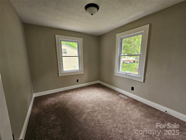 3824 Freedom Dr, Charlotte, NC 28208 - carpeted empty room featuring a textured ceiling and baseboards