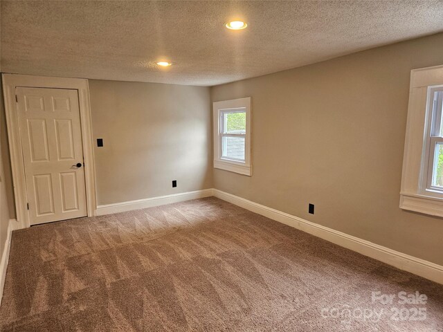 3824 Freedom Dr, Charlotte, NC 28208 - unfurnished room with carpet floors, a textured ceiling, and recessed lighting