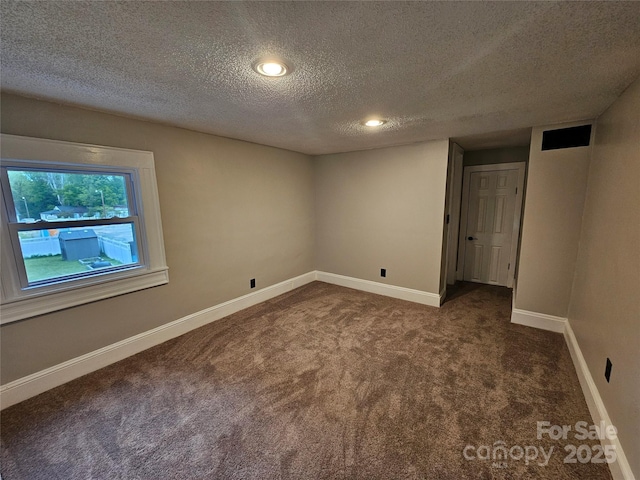 3824 Freedom Dr, Charlotte, NC 28208 - carpeted spare room featuring a textured ceiling and recessed lighting