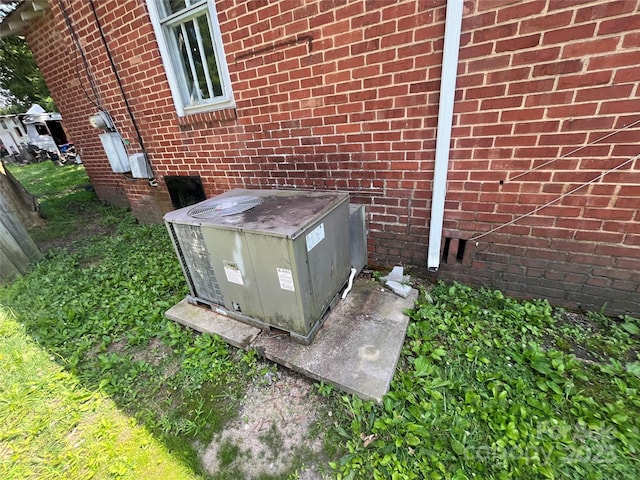 119 Hemlock Ave, Kannapolis, NC 28081 - exterior view of a central air condition unit and brick siding