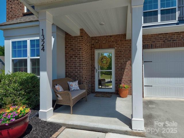 1324 Mona Vale Dr, Huntersville, NC 28078 - view of exterior entry featuring brick siding and a garage