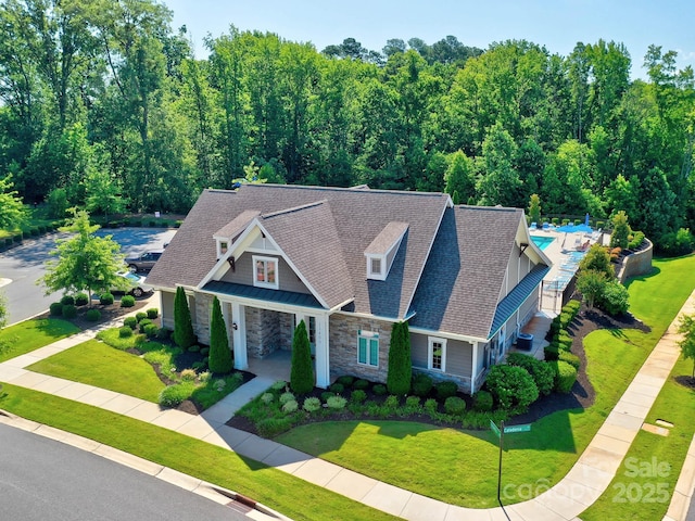 1324 Mona Vale Dr, Huntersville, NC 28078 - craftsman-style home with stone siding, a shingled roof, and a front yard