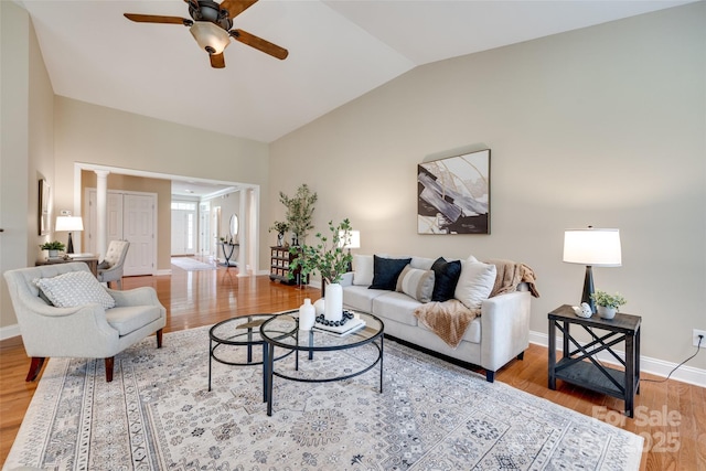 3905 Hounslow Ln, Harrisburg, NC 28075 - living area with lofted ceiling, ceiling fan, light wood finished floors, and ornate columns