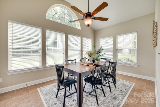 3905 Hounslow Ln, Harrisburg, NC 28075 - dining area with a ceiling fan, light tile patterned floors, and high vaulted ceiling