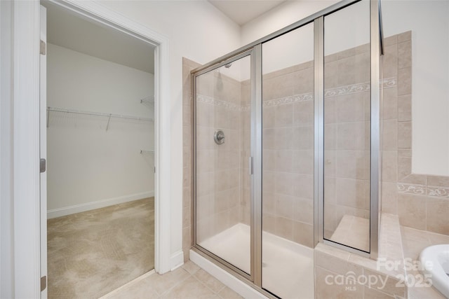 3905 Hounslow Ln, Harrisburg, NC 28075 - full bath with a stall shower, a walk in closet, and a bath