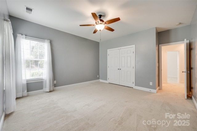 3905 Hounslow Ln, Harrisburg, NC 28075 - unfurnished bedroom featuring light colored carpet, a closet, and ceiling fan