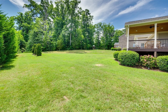 3905 Hounslow Ln, Harrisburg, NC 28075 - view of green lawn featuring a ceiling fan