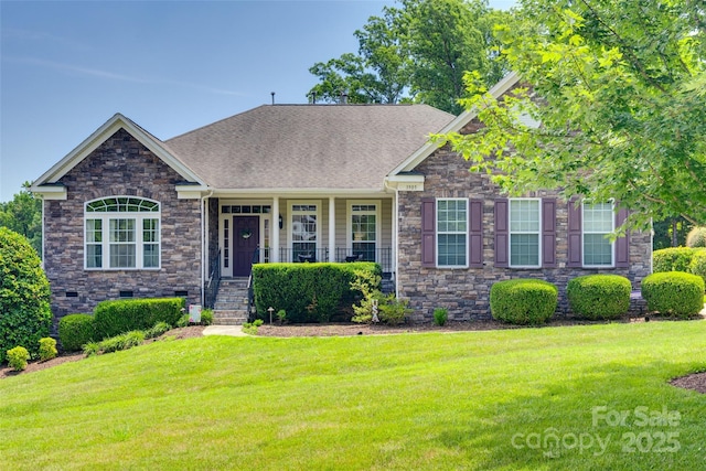 3905 Hounslow Ln, Harrisburg, NC 28075 - craftsman inspired home with stone siding, a front lawn, roof with shingles, and a porch