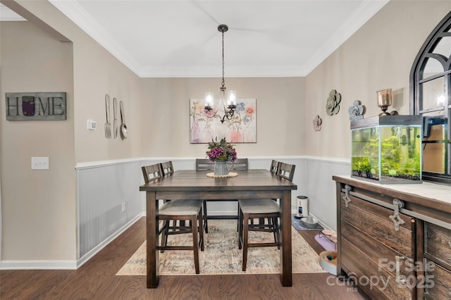 282 Harrison Ln, Locust, NC 28097 - dining space featuring dark wood-type flooring, a chandelier, and crown molding
