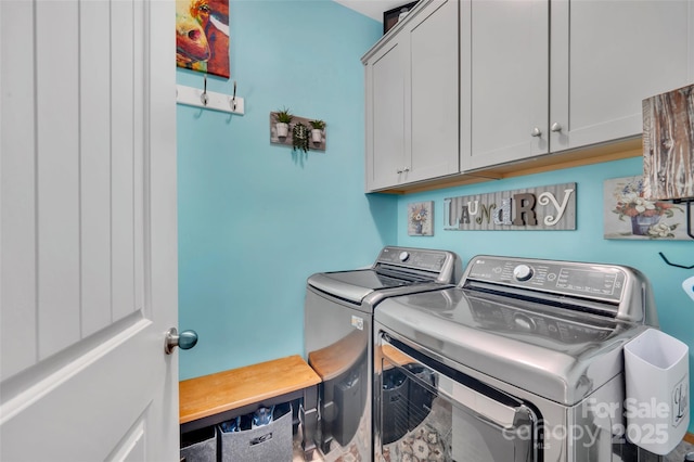 282 Harrison Ln, Locust, NC 28097 - laundry room featuring cabinet space and washing machine and clothes dryer