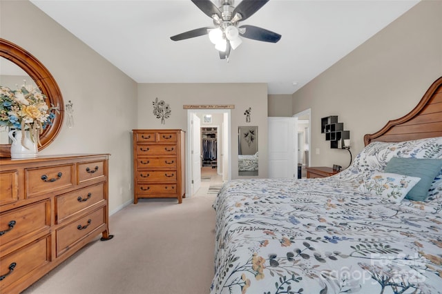 282 Harrison Ln, Locust, NC 28097 - bedroom with light colored carpet, a walk in closet, and a ceiling fan