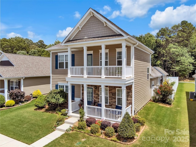 282 Harrison Ln, Locust, NC 28097 - view of front of home with a porch, a balcony, and a front yard