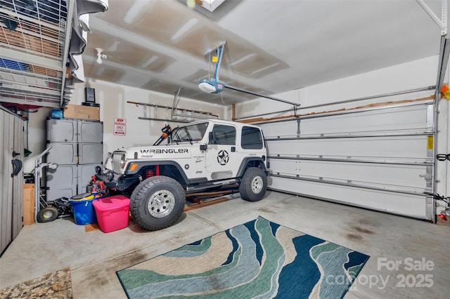 282 Harrison Ln, Locust, NC 28097 - garage featuring a garage door opener
