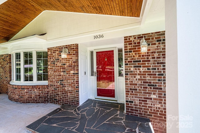 1036 11th Street Circle Dr NW, Hickory, NC 28601 - view of exterior entry with brick siding and a porch
