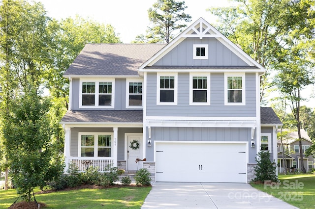 5499 Angus Dr, Midland, NC 28107 - craftsman inspired home featuring board and batten siding, driveway, a porch, and roof with shingles