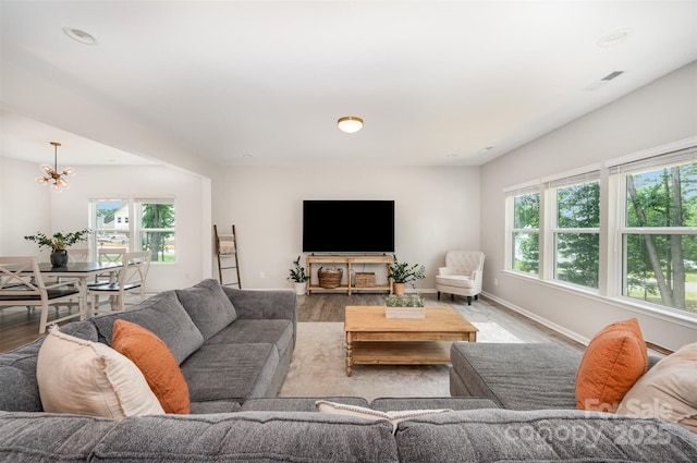 5499 Angus Dr, Midland, NC 28107 - living room with plenty of natural light, a chandelier, wood finished floors, and recessed lighting