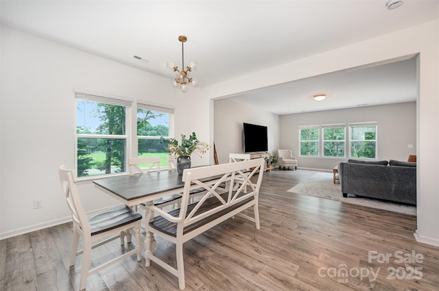5499 Angus Dr, Midland, NC 28107 - dining room featuring a chandelier and wood finished floors