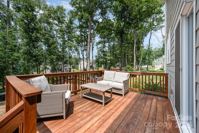 5499 Angus Dr, Midland, NC 28107 - wooden deck featuring outdoor lounge area and view of wooded area