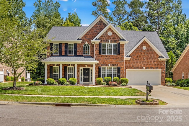 1011 Wadsworth Ln, Indian Trail, NC 28079 - view of front of property with driveway, brick siding, and a front lawn