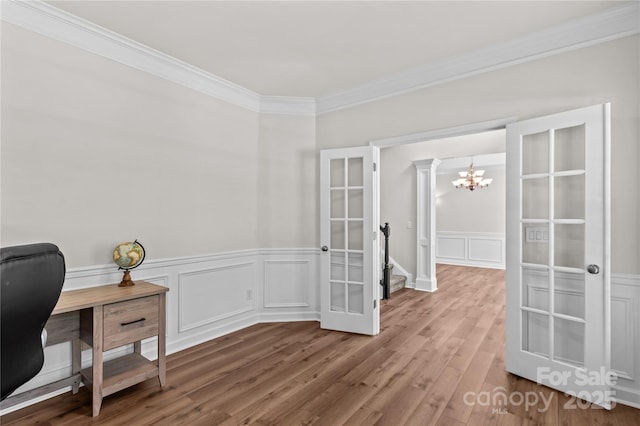 1011 Wadsworth Ln, Indian Trail, NC 28079 - office area with crown molding, french doors, a chandelier, wood finished floors, and wainscoting