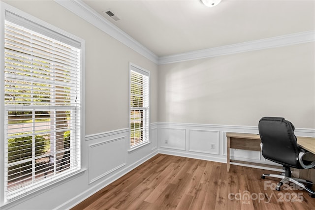 1011 Wadsworth Ln, Indian Trail, NC 28079 - home office featuring wood finished floors, crown molding, and a wainscoted wall