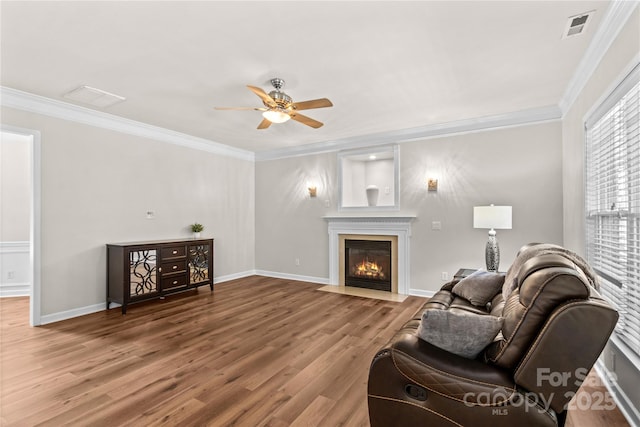 1011 Wadsworth Ln, Indian Trail, NC 28079 - living room with ceiling fan, ornamental molding, wood finished floors, and a fireplace with flush hearth