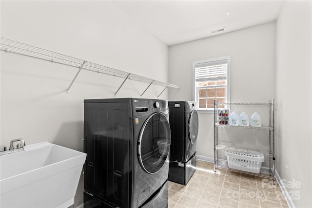 1011 Wadsworth Ln, Indian Trail, NC 28079 - laundry area with washer and clothes dryer and baseboards