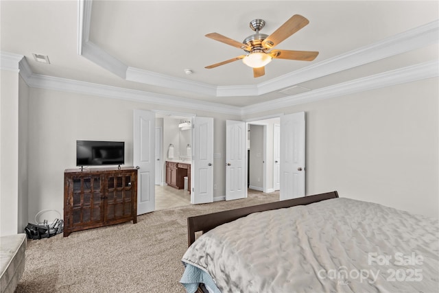 1011 Wadsworth Ln, Indian Trail, NC 28079 - carpeted bedroom featuring crown molding, a tray ceiling, a ceiling fan, and ensuite bath