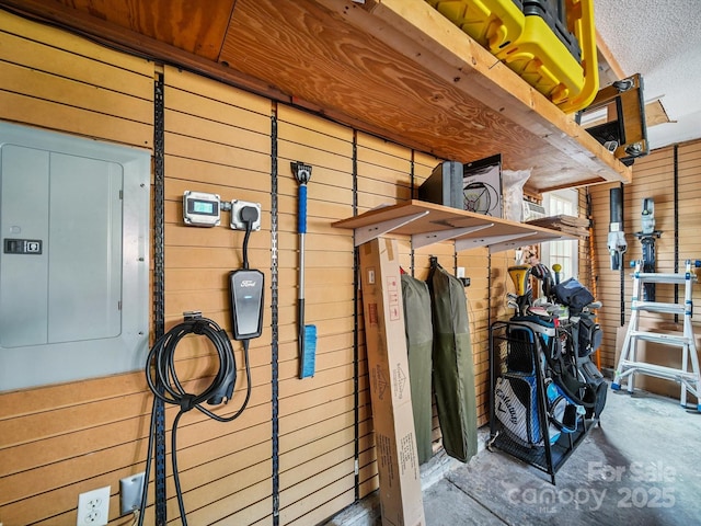 16411 Greybriar Forest Ln, Charlotte, NC 28278 - garage view of wooden walls, electric panel, and concrete floors