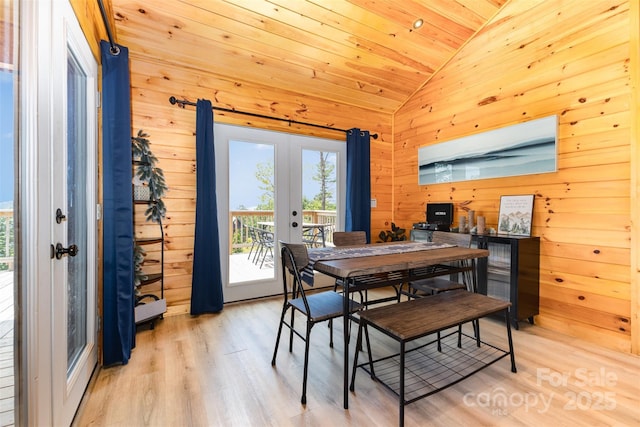 7025 Martin Ln, Morganton, NC 28655 - dining room featuring vaulted ceiling, french doors, wooden walls, light wood finished floors, and wood ceiling