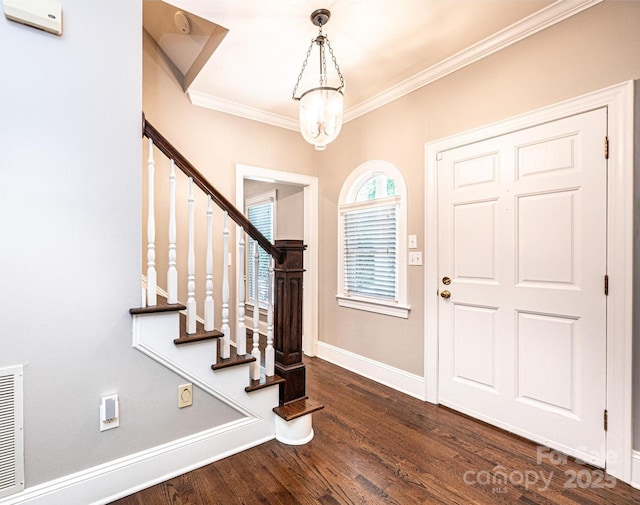 841 16th Avenue Ln NW, Hickory, NC 28601 - entryway with ornamental molding, dark wood finished floors, stairway, and a chandelier