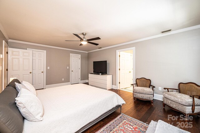 841 16th Avenue Ln NW, Hickory, NC 28601 - bedroom with dark wood-style floors, crown molding, ceiling fan, and multiple closets