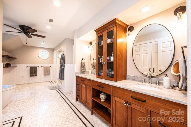 841 16th Avenue Ln NW, Hickory, NC 28601 - full bath with double vanity, a wainscoted wall, a ceiling fan, a soaking tub, and recessed lighting
