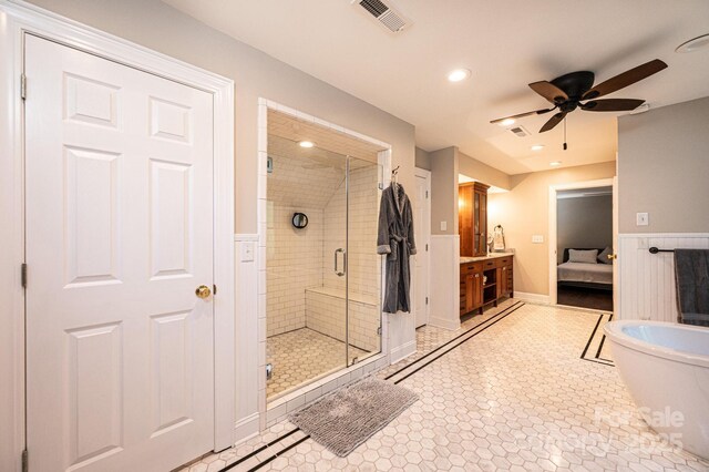 841 16th Avenue Ln NW, Hickory, NC 28601 - ensuite bathroom with a stall shower, vanity, a ceiling fan, a wainscoted wall, and a freestanding tub