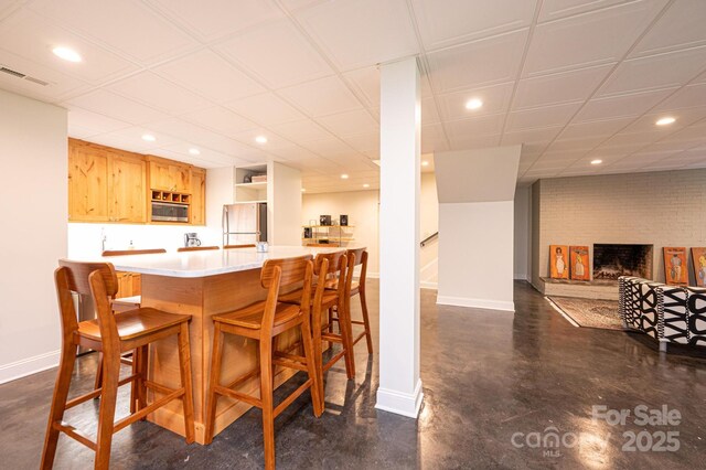 841 16th Avenue Ln NW, Hickory, NC 28601 - kitchen featuring freestanding refrigerator, recessed lighting, stainless steel microwave, finished concrete flooring, and light countertops