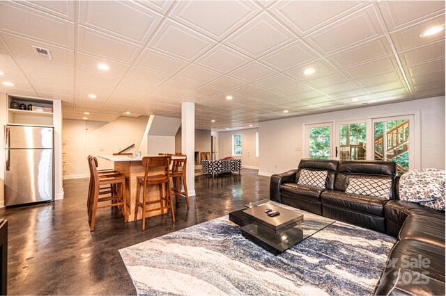 841 16th Avenue Ln NW, Hickory, NC 28601 - living room with recessed lighting, bar, and concrete floors