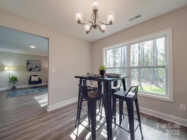 1016 Forest Dr, Marshville, NC 28103 - dining area with a chandelier, healthy amount of natural light, wood finished floors, and recessed lighting