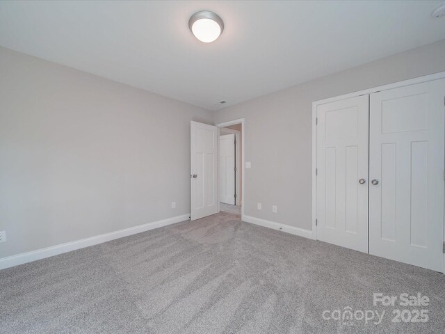 1016 Forest Dr, Marshville, NC 28103 - unfurnished bedroom featuring carpet floors and a closet