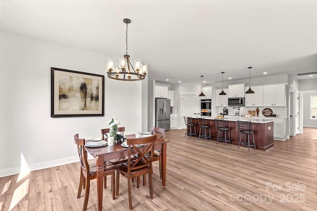 1260 Coppergate Dr, Salisbury, NC 28147 - dining area featuring a chandelier, recessed lighting, and light wood-type flooring