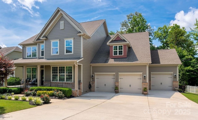 1805 Trading Path Ln, Waxhaw, NC 28173 - craftsman-style home with brick siding, covered porch, a garage, concrete driveway, and roof with shingles