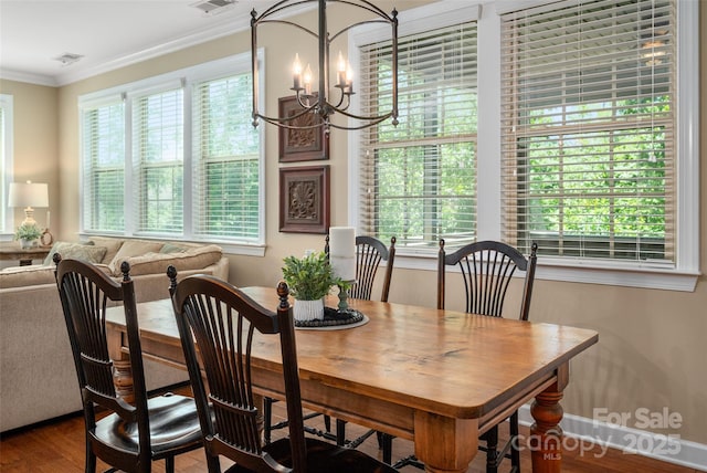 1805 Trading Path Ln, Waxhaw, NC 28173 - dining room featuring a chandelier, healthy amount of natural light, wood finished floors, and crown molding