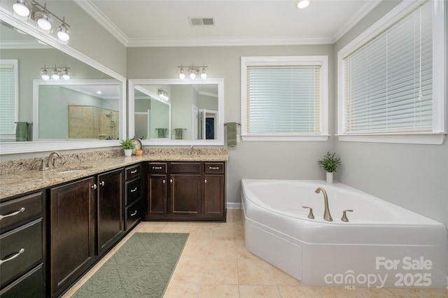 1805 Trading Path Ln, Waxhaw, NC 28173 - full bath with double vanity, a garden tub, tiled shower, ornamental molding, and tile patterned floors