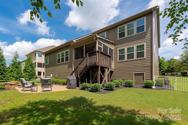 1805 Trading Path Ln, Waxhaw, NC 28173 - rear view of property with a sunroom, a patio area, stairway, and an outdoor fire pit