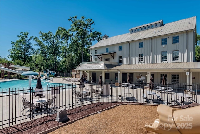 1805 Trading Path Ln, Waxhaw, NC 28173 - community pool featuring a water slide and a patio